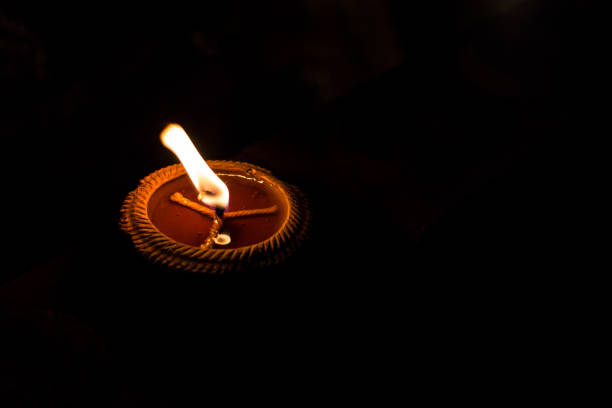 istock candles in the dark background. 827862300