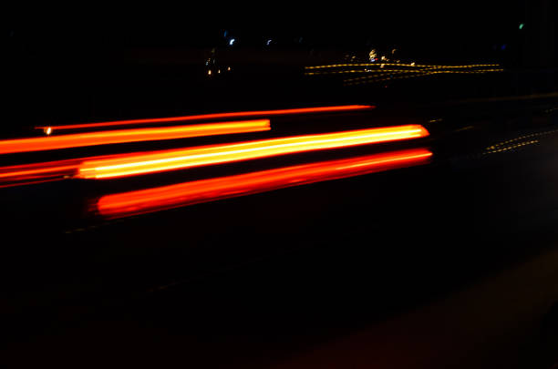 Trails of the car lights on night road