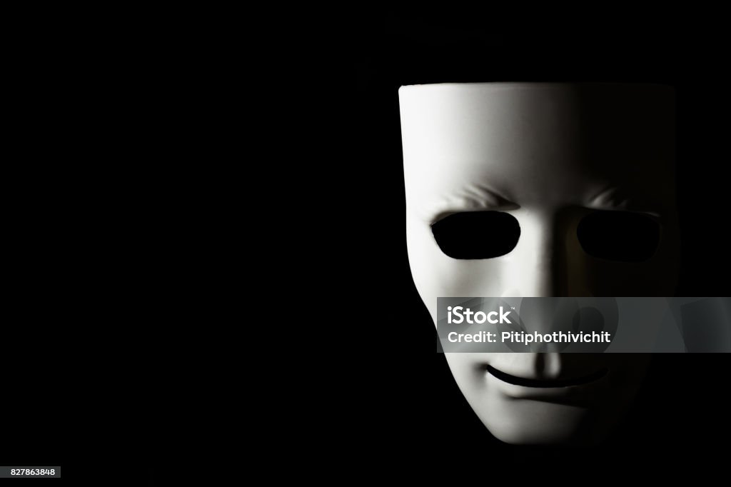 White mask and shadow on black background Concept of Halloween Stage Theater Stock Photo