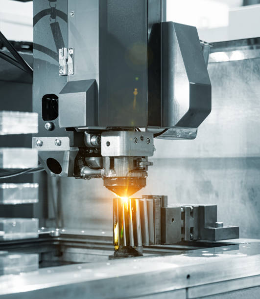 istock CNC wire cut machine cutting mold parts 827867696