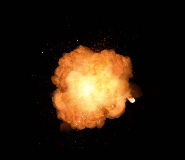 Huge, extremely hot explosion with sparks and hot smoke, against black background stock photo