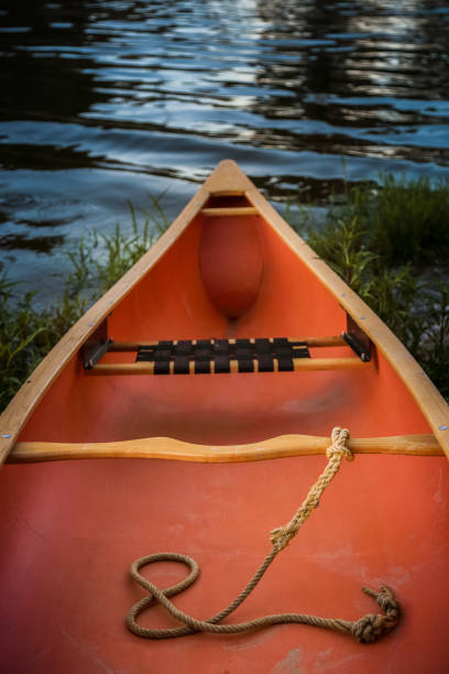 istock Yellow Canoe stranded on river bank at dusk 827871106