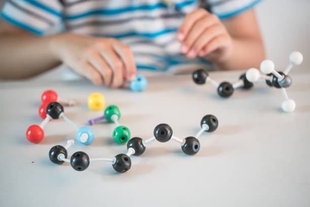 istock one asian boy playing ball and stick structure in the classroom 827871214