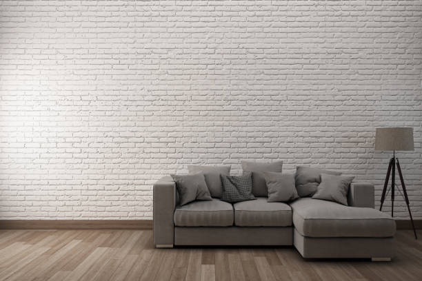 istock White brick wall & wooden floor with sofa.3D Illustration. 827872012