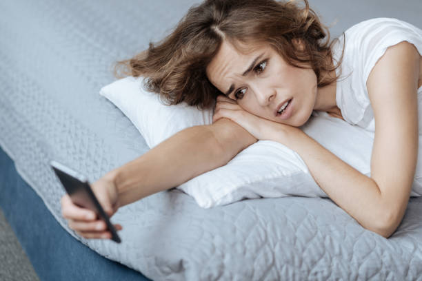 istock Unhappy surprised woman reading a message 827872234