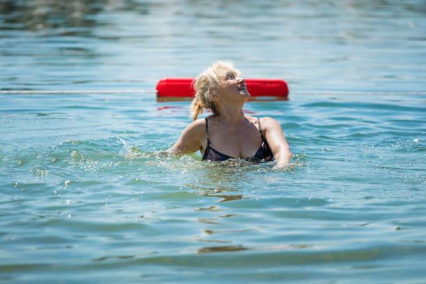 istock Senior woman on summer holiday 827878908