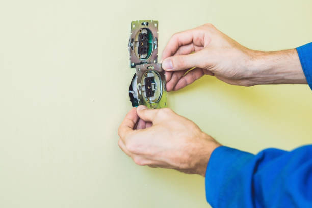 istock Electrician Installing Socket In New House 827879296