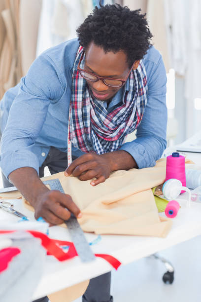 istock Fashion designer measuring clothes 827879556