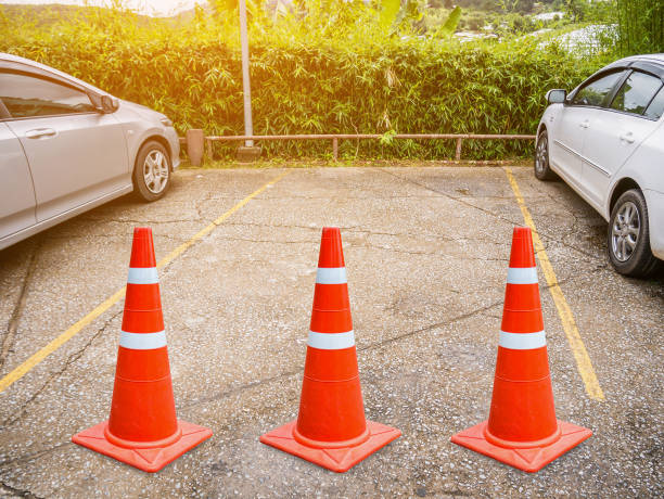 istock Vacant parking lot with traffic cone 827879994