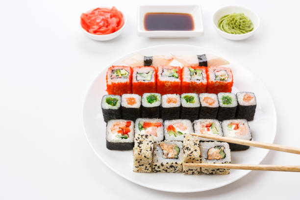 istock Set of sushi and rolls on white background, pov view 827880470