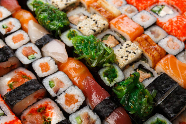 istock Set of sushi, maki and rolls background 827881202