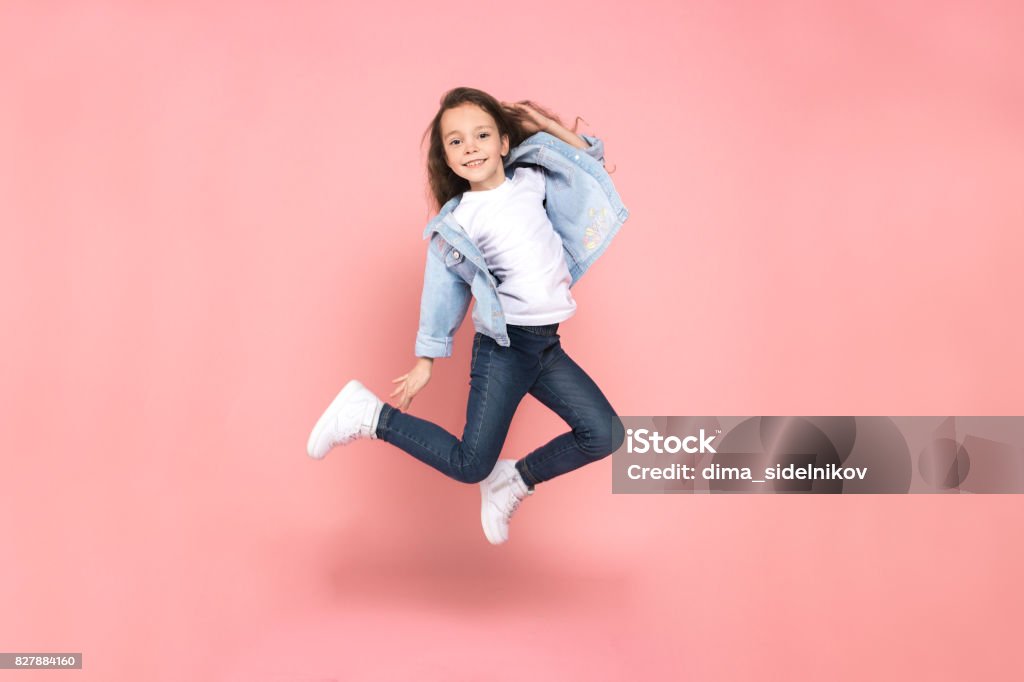 Young girl teen youth trends studio portrait Young female teen youth trends studio jumping Child Stock Photo
