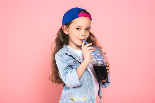 Young female teen youth trends studio drinking juice