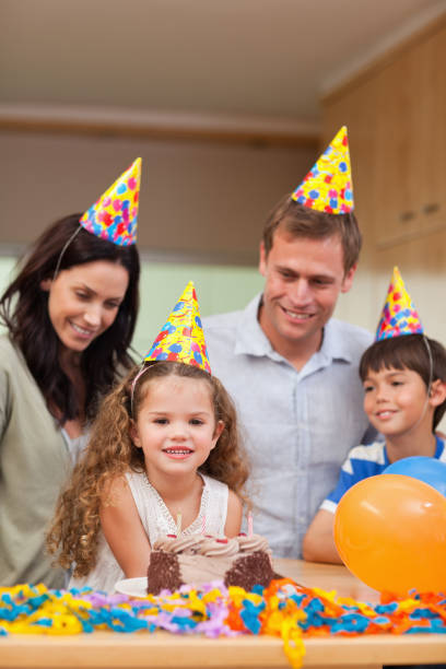 istock Family celebrating daughters birthday 827884746