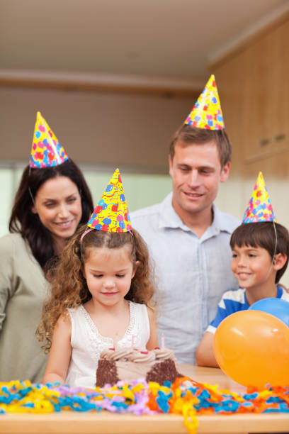 istock Happy family celebrating daughters birthday 827884760