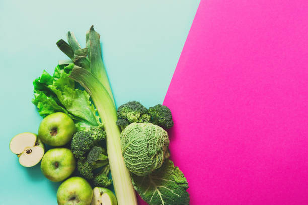 istock Flat lay of green vegetables on bright background 827891044