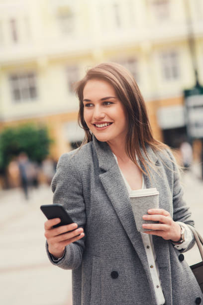 istock Woman texting in the city 827891172