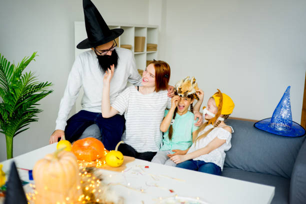 istock Family dressed in halloween costumes 827896320