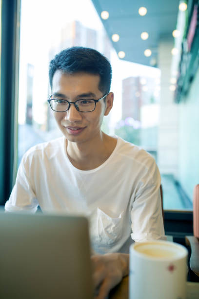 istock man working on laptop in cafe 827897056