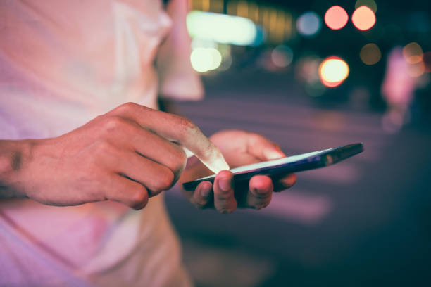 istock Man using his mobile phone in the street 827901512