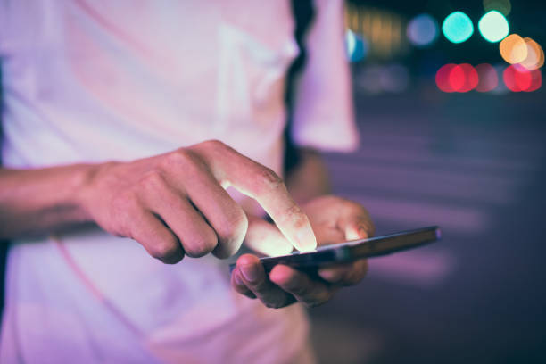 istock Man using his mobile phone in the street 827901556