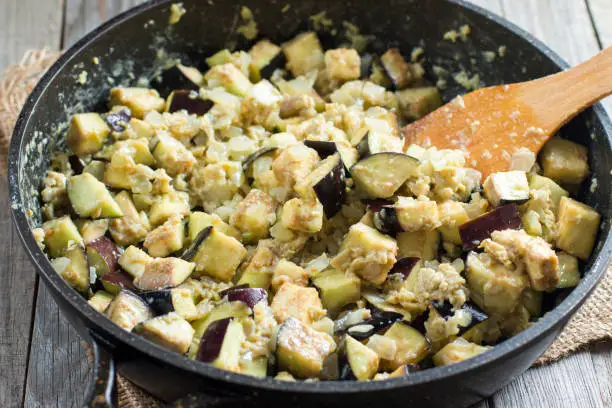 Photo of Cubes of eggplant in a frying pan