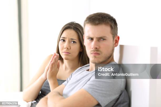 Wife Begging And Angry Husband Stock Photo - Download Image Now - Men, Envy, Girls