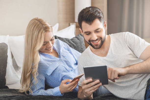 istock Young couple travel together hotel room leisure 827904708