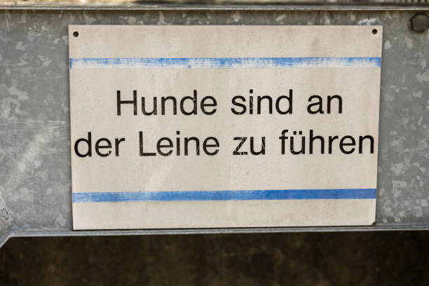 istock dog on leash sign in german 827905776