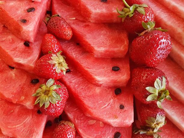 tile of sliced watermelons and strawberries