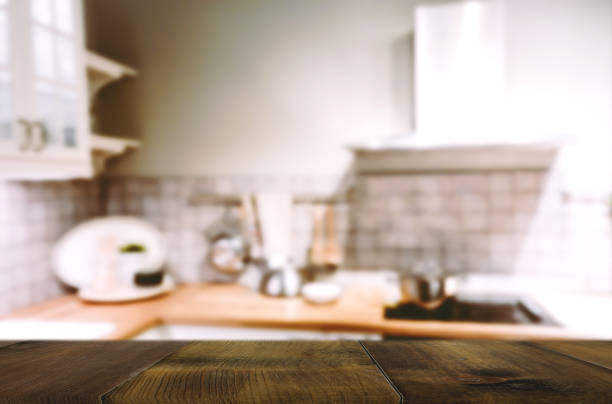 istock Wood table on blur Interior of kitchen background 827910252