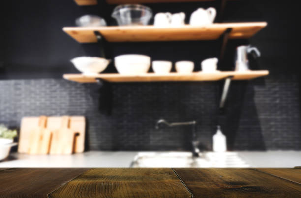 istock Wood table on blur Interior of kitchen background 827910300