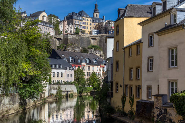 Luxembourg City - City of Luxembourg Luxembourg City - Ville de Luxembourg. The walls of the old town viewed from the Grund area of the Grand Duchy. petrusse stock pictures, royalty-free photos & images