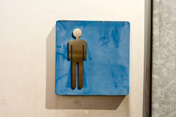 toilet sign man old in washed out blue