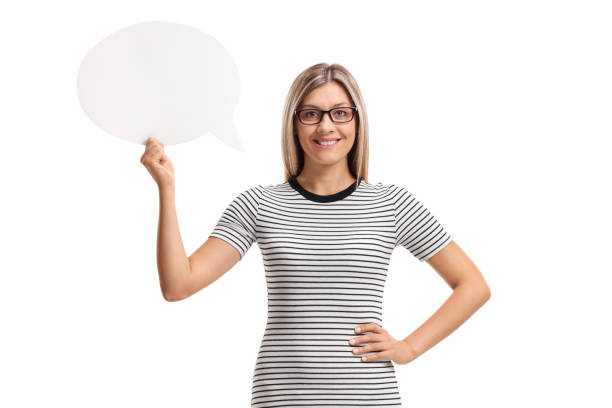 istock Young woman holding a chat bubble and smiling 827914134