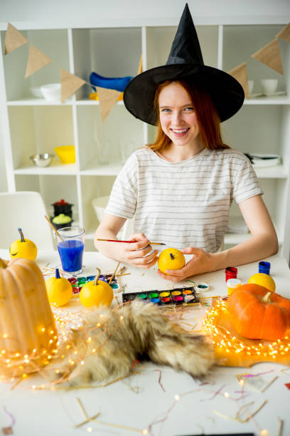 istock Girl in a witch costume 827917372