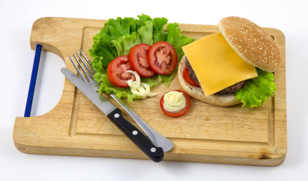 istock Fresh home-made hamburger served on wood on white background 827918436