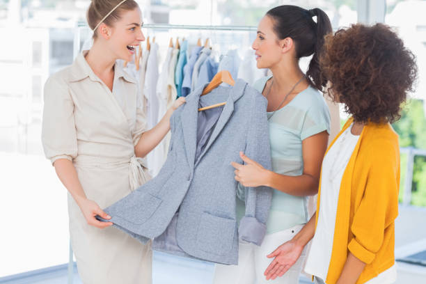 istock Smiling women holding a blazer 827920924