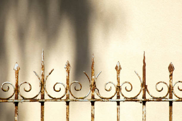 istock Retro styled cast iron fence and shadow. 827922108