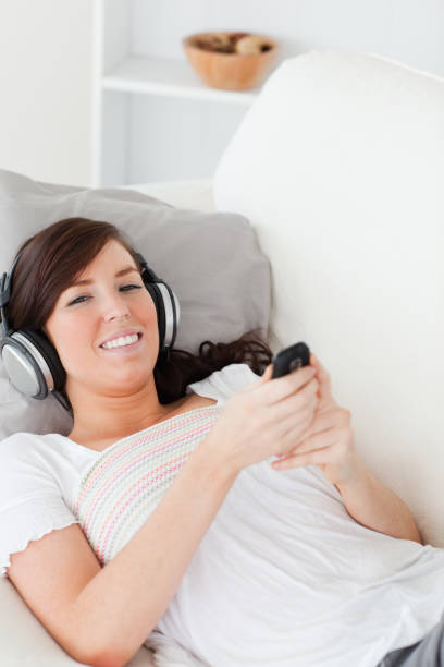 istock Beautiful brunette woman writing a text on her mobile 827925442
