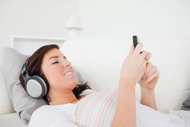 istock Cute brunette woman writing a text on her mobile 827925542