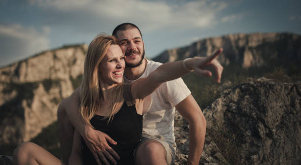 istock Couple on top of the mountain 827929068