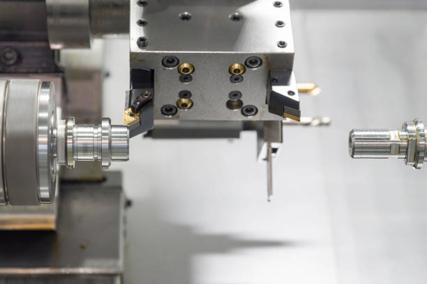 istock CNC lathe machine or Turning machine drilling  the steel rod . 827929686