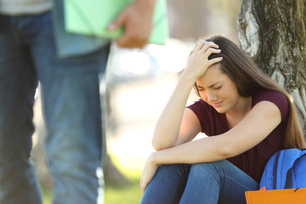 istock Couple of students breaking up relationship 827930286