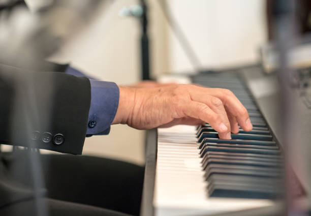 istock Pianist playing electric piano 827941532