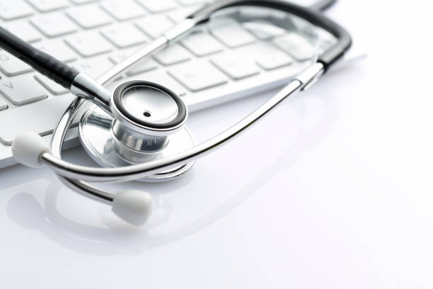 Medical stethoscope on white keyboard