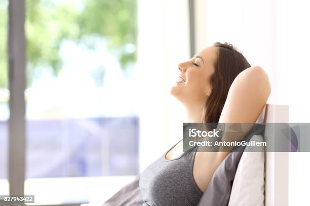 Woman Relaxing On The Bed In An Hotel Room Stock Photo - Download Image Now - Non-Urban Scene, Indoors, Home Interior