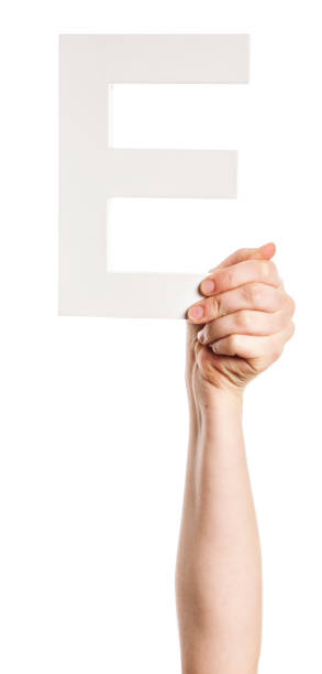 istock Woman's hand and arm holds up 3-D capital letter E 827947846