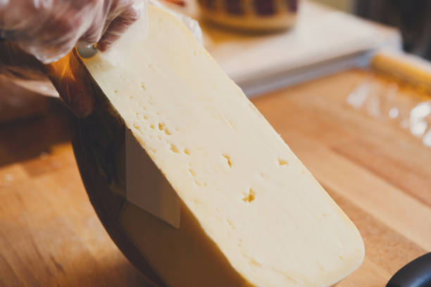istock Gouda cheese closeup, cheese background 827951240