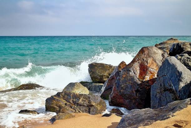 istock Sea waves hitting the rocky beach at Malgrat de Mar, Spain 827955278